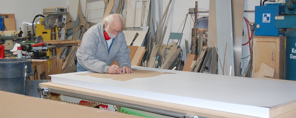 neal working on a laminating job